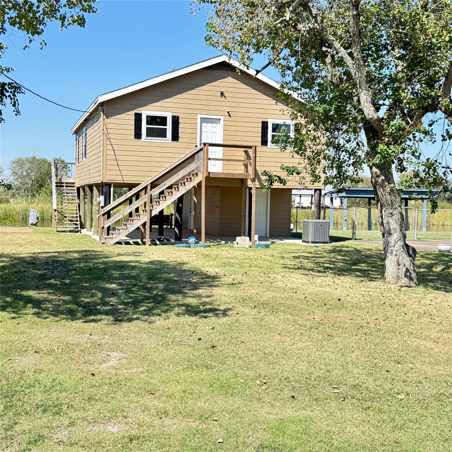143 Bastrop Bayou Drive Angleton, TX 77515 - Photo 2 of 32 a view of a house with a yard
