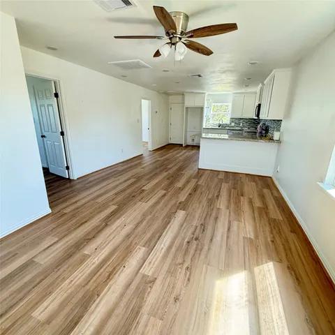 a view of a livingroom with wooden floor