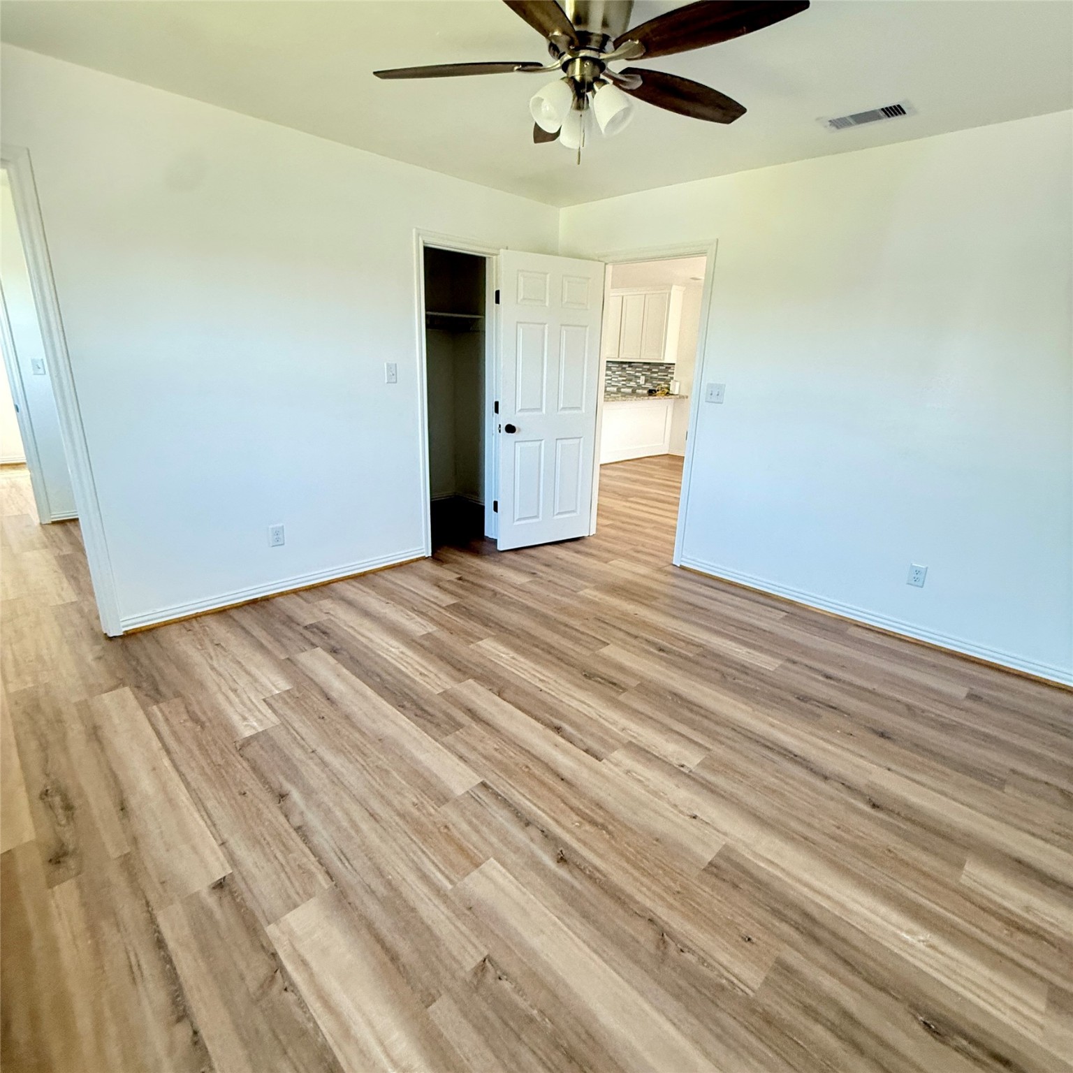 143 Bastrop Bayou Drive Angleton, TX 77515 - Photo 24 of 32 a view of an empty room with wooden floor