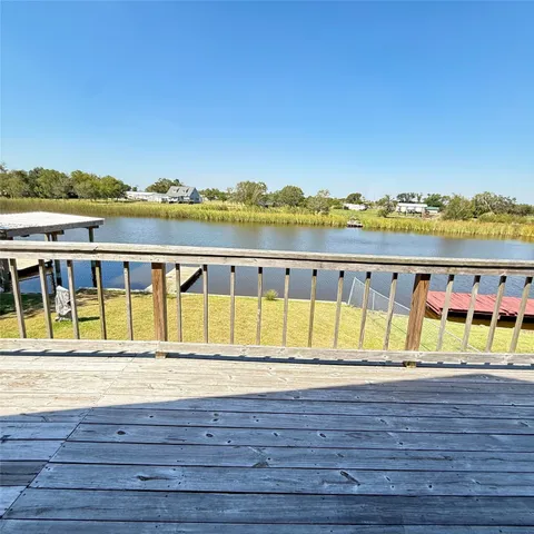 a view of swimming pool with outdoor seating and yard in the back