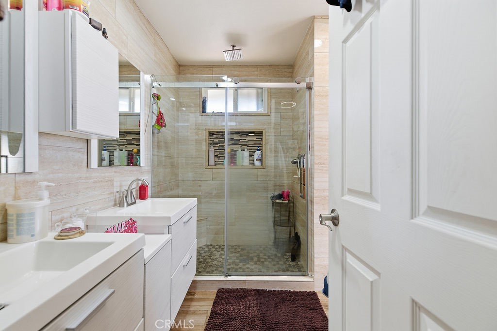 5390 Karling Place Palmdale, CA 93552 - Photo 11 of 36 a bathroom with a sink and a shower