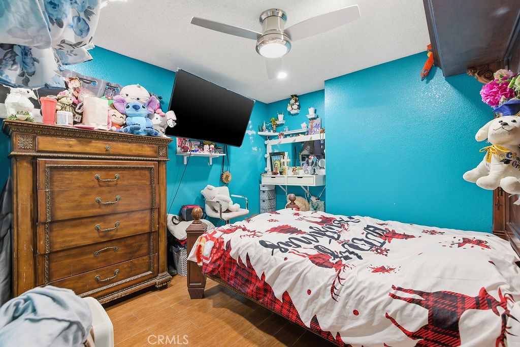 5390 Karling Place Palmdale, CA 93552 - Photo 18 of 36 a bedroom with a bed and a dresser