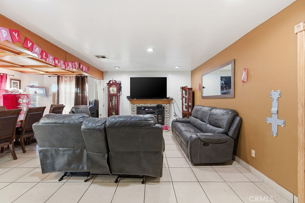 5390 Karling Place Palmdale, CA 93552 - Photo 22 of 36 a living room with furniture and a flat screen tv