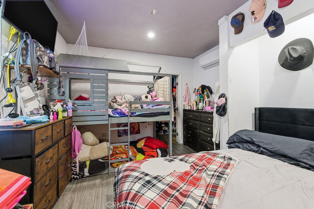 5390 Karling Place Palmdale, CA 93552 - Photo 28 of 36 a bed room with a bed and a desk