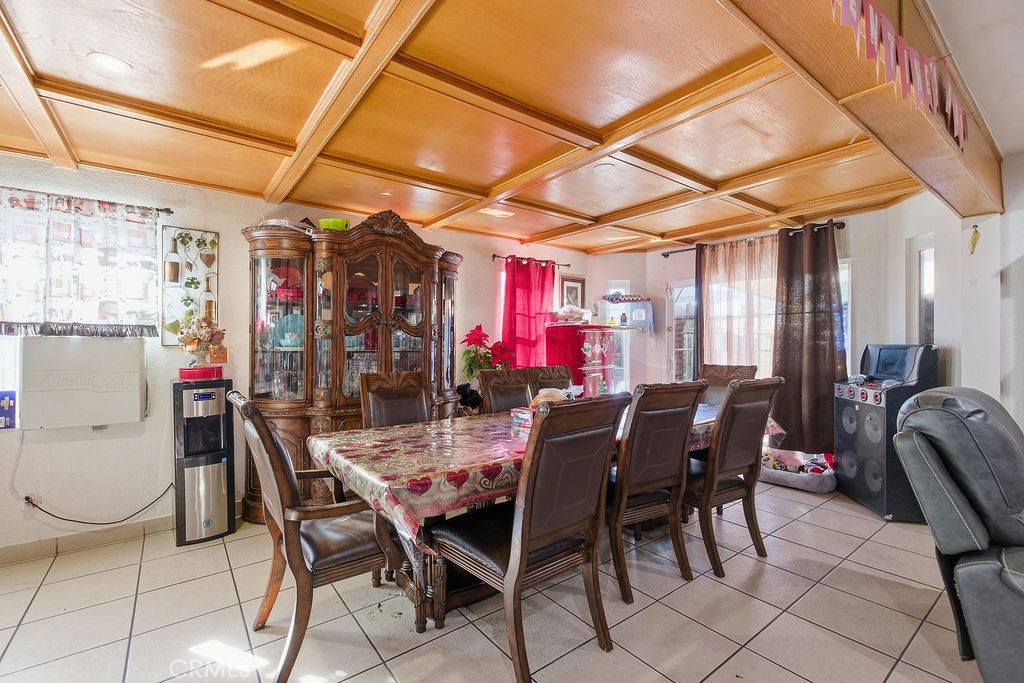 5390 Karling Place Palmdale, CA 93552 - Photo 30 of 36 a view of a dining room with furniture and chandelier