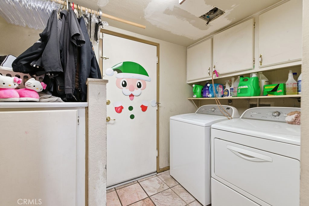 5390 Karling Place Palmdale, CA 93552 - Photo 31 of 36 a utility room with dryer and washer