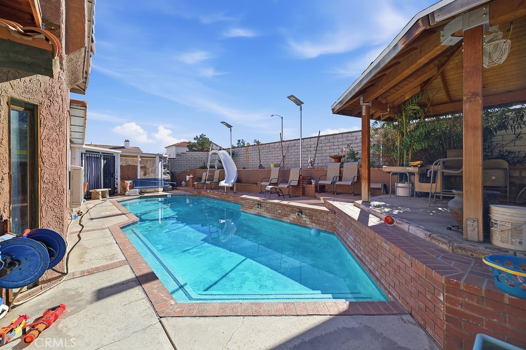 5390 Karling Place Palmdale, CA 93552 - Photo 32 of 36 a view of a backyard with sitting area