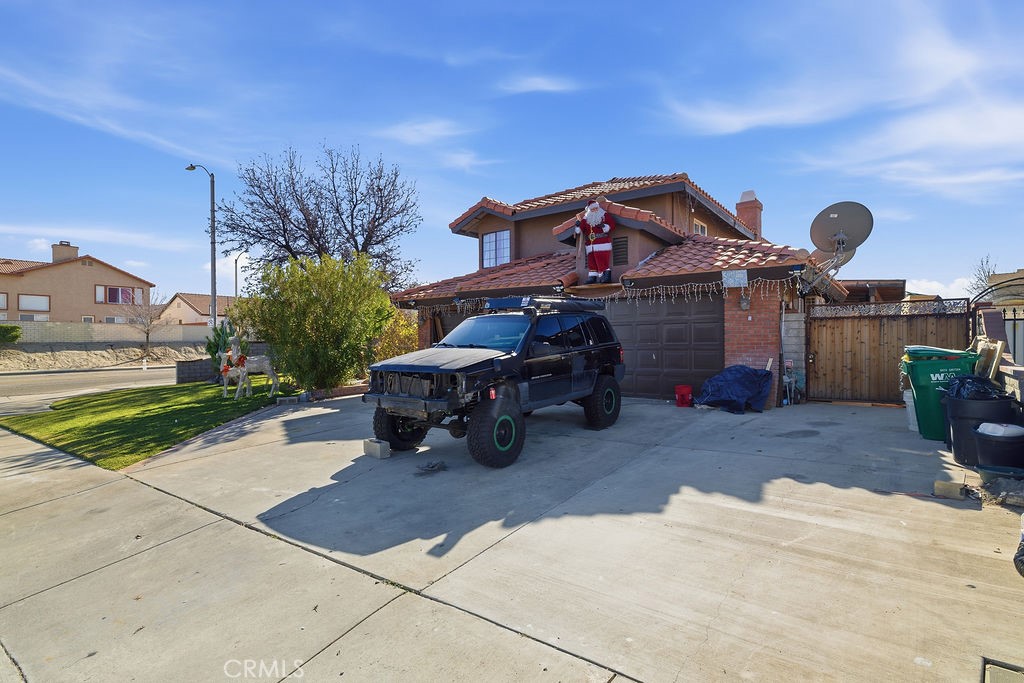 5390 Karling Place Palmdale, CA 93552 - Photo 36 of 36 a house view with a sitting space fire pit and outdoor space