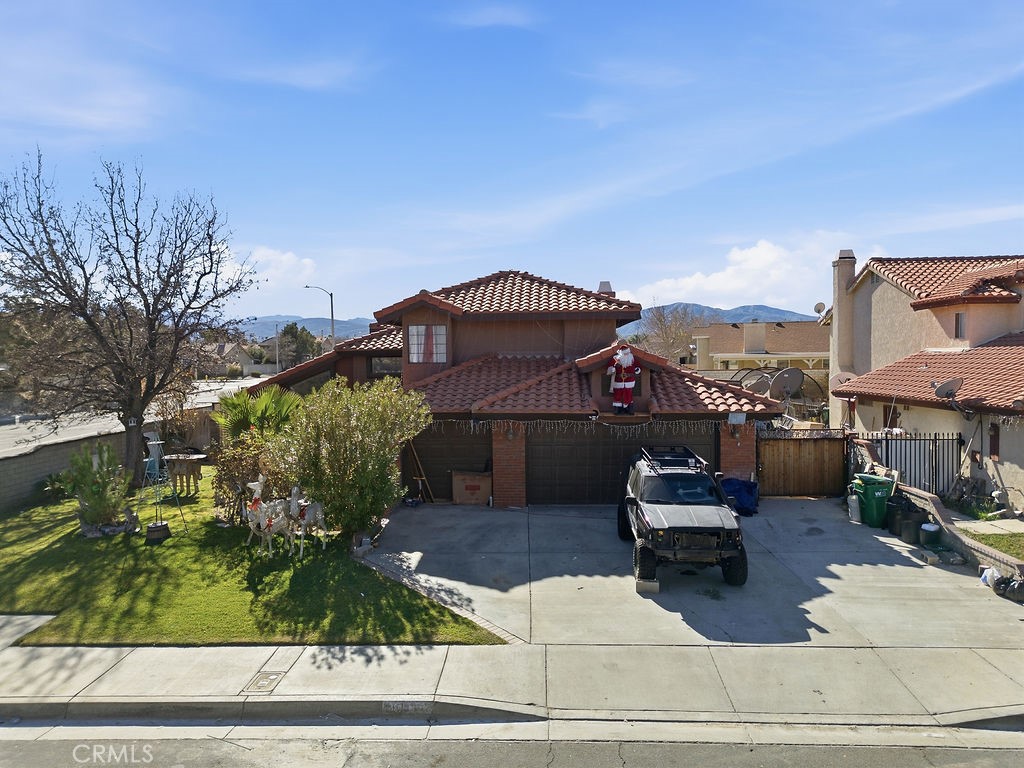 5390 Karling Place Palmdale, CA 93552 - Photo 4 of 36 a view of a house with a patio