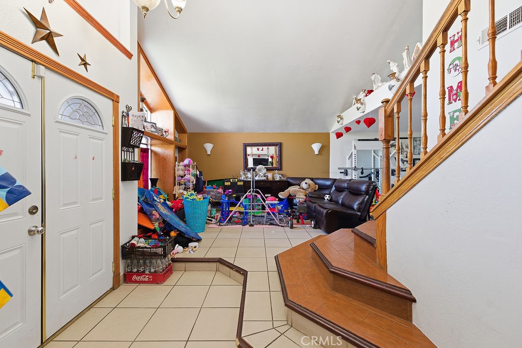 5390 Karling Place Palmdale, CA 93552 - Photo 7 of 36 a view of a hallway with furniture and toys
