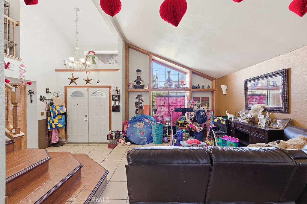 5390 Karling Place Palmdale, CA 93552 - Photo 9 of 36 a living room with furniture and a flat screen tv
