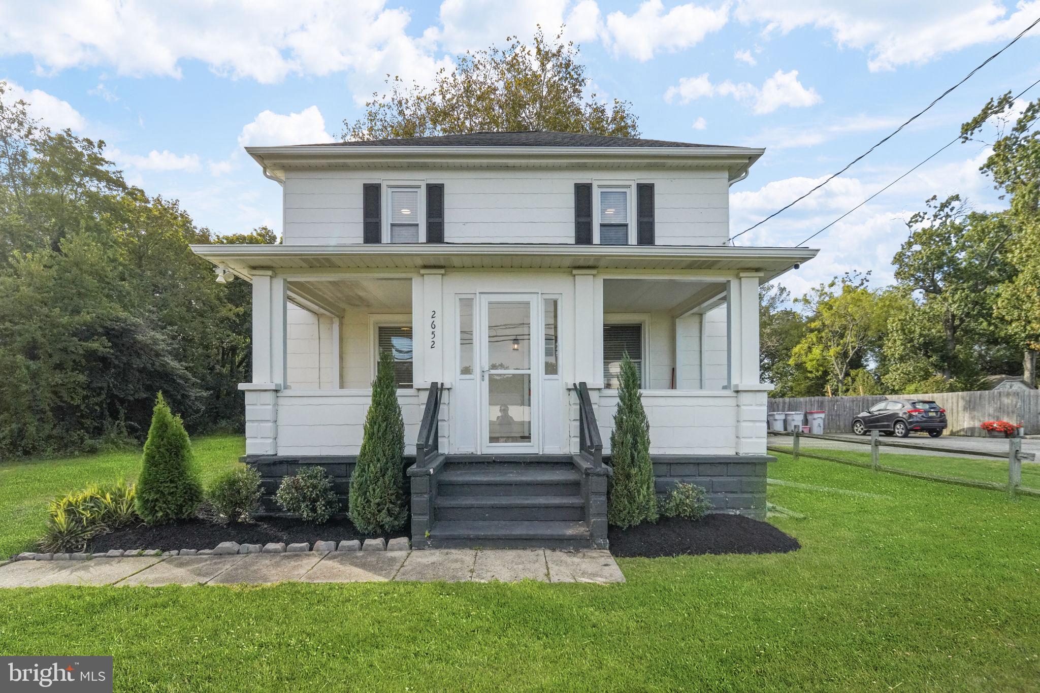 front view of a house with a yard