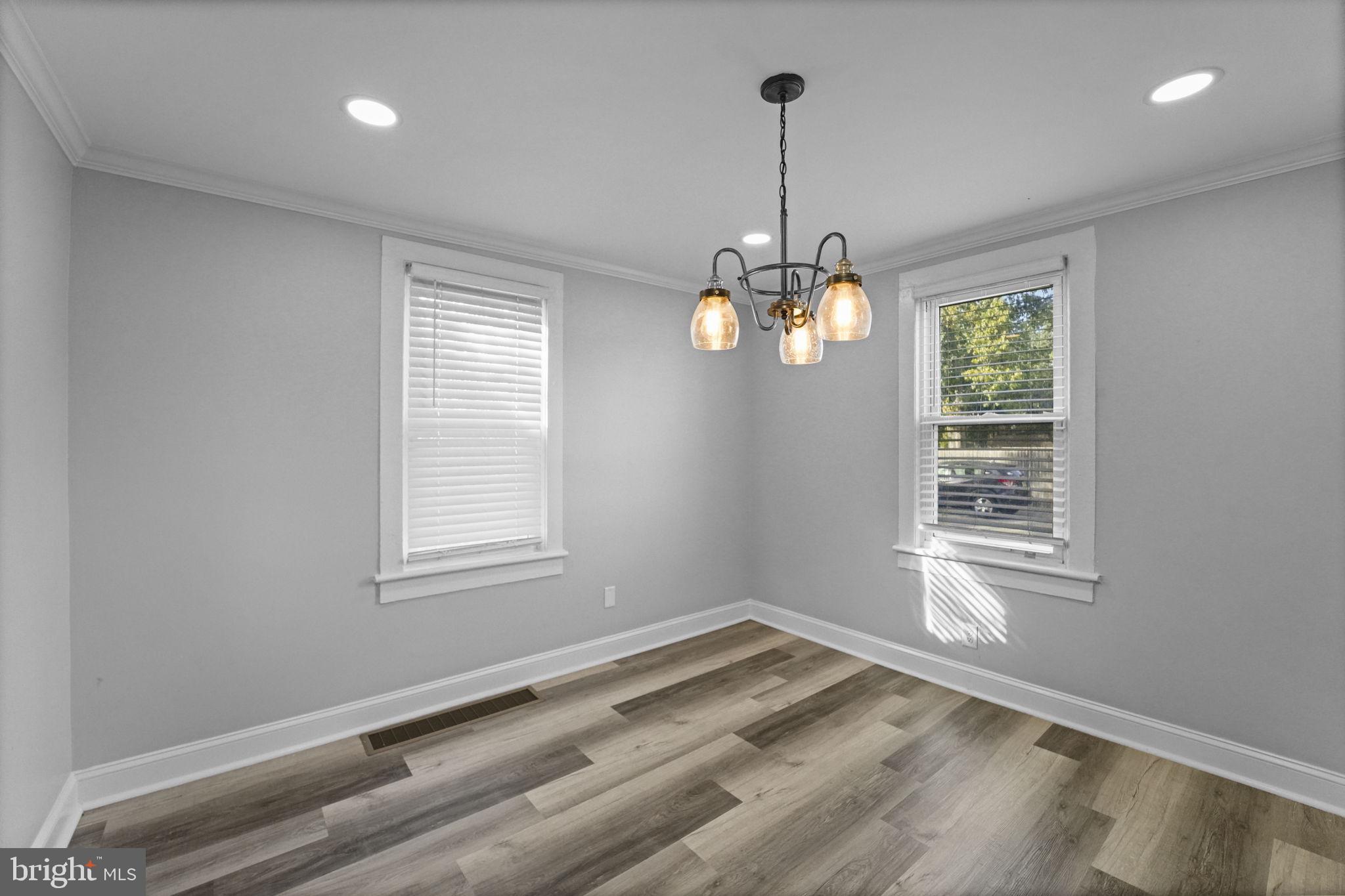 2652 South Main Road Vineland, NJ 08360 - Photo 13 of 44 a view of an empty room with window and chandelier fan