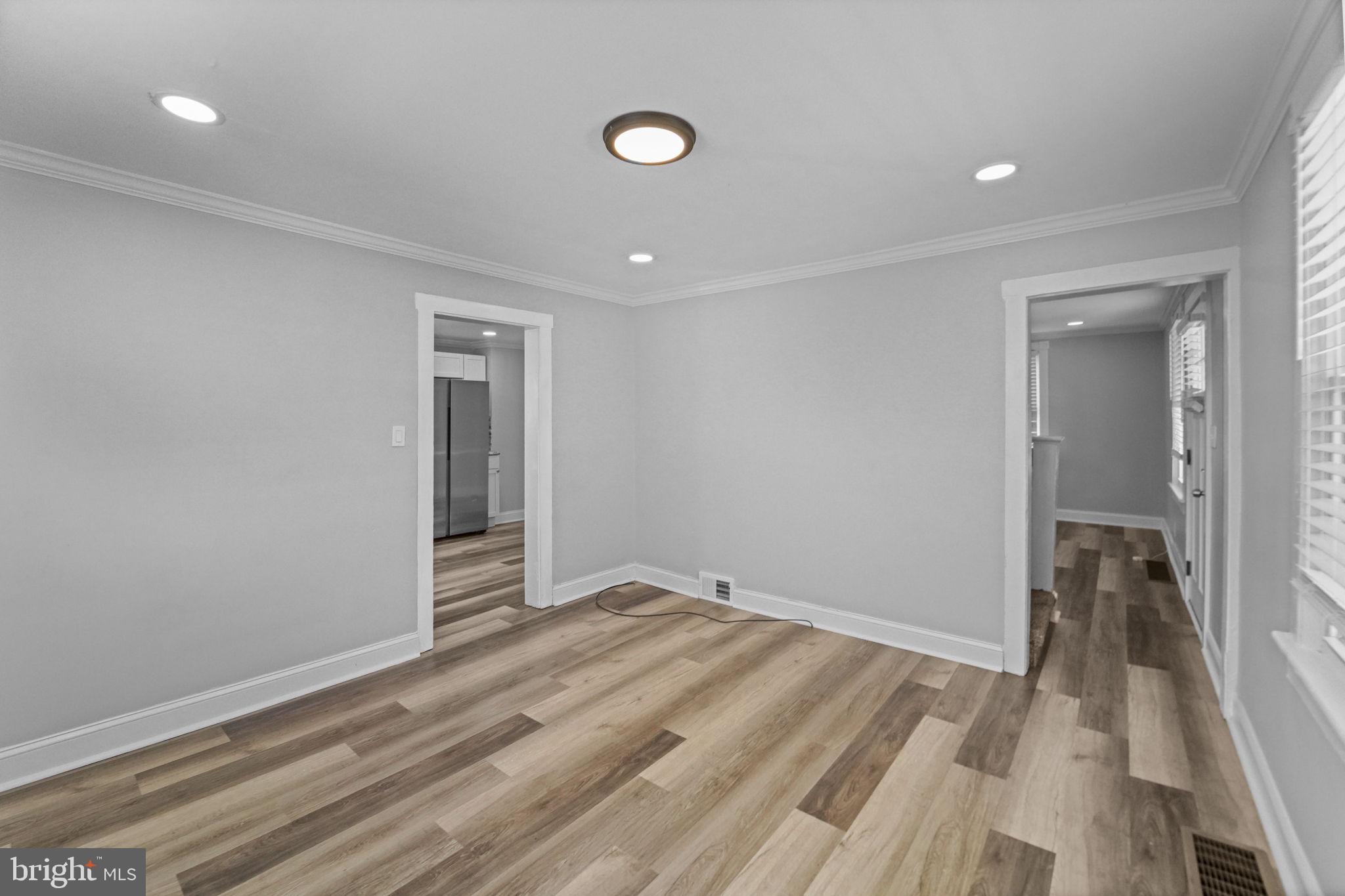 2652 South Main Road Vineland, NJ 08360 - Photo 17 of 44 wooden floor in an empty room with a window