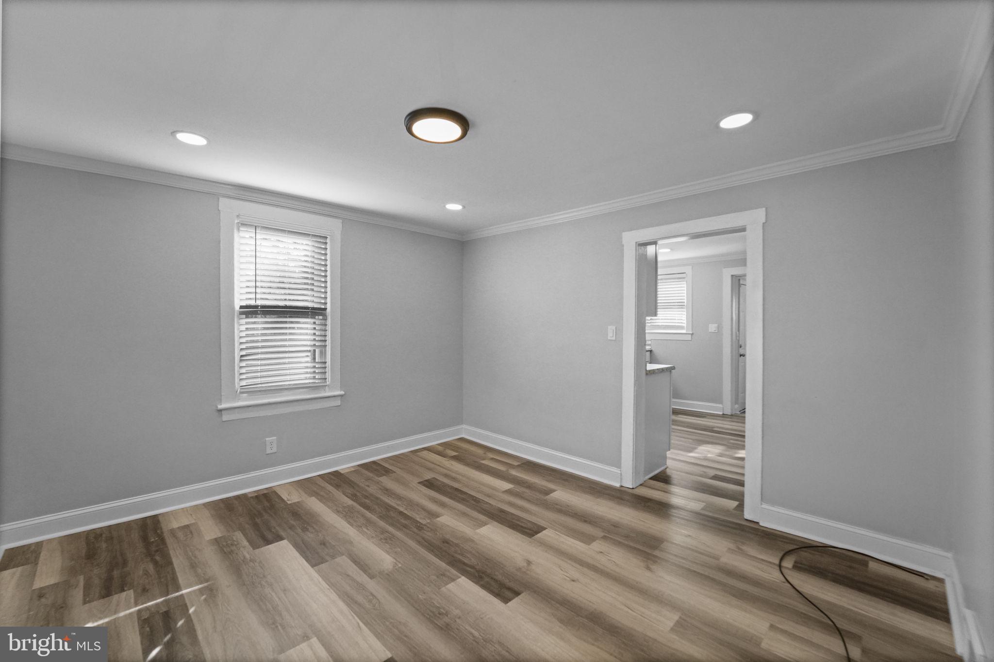 2652 South Main Road Vineland, NJ 08360 - Photo 18 of 44 an empty room with wooden floor and windows
