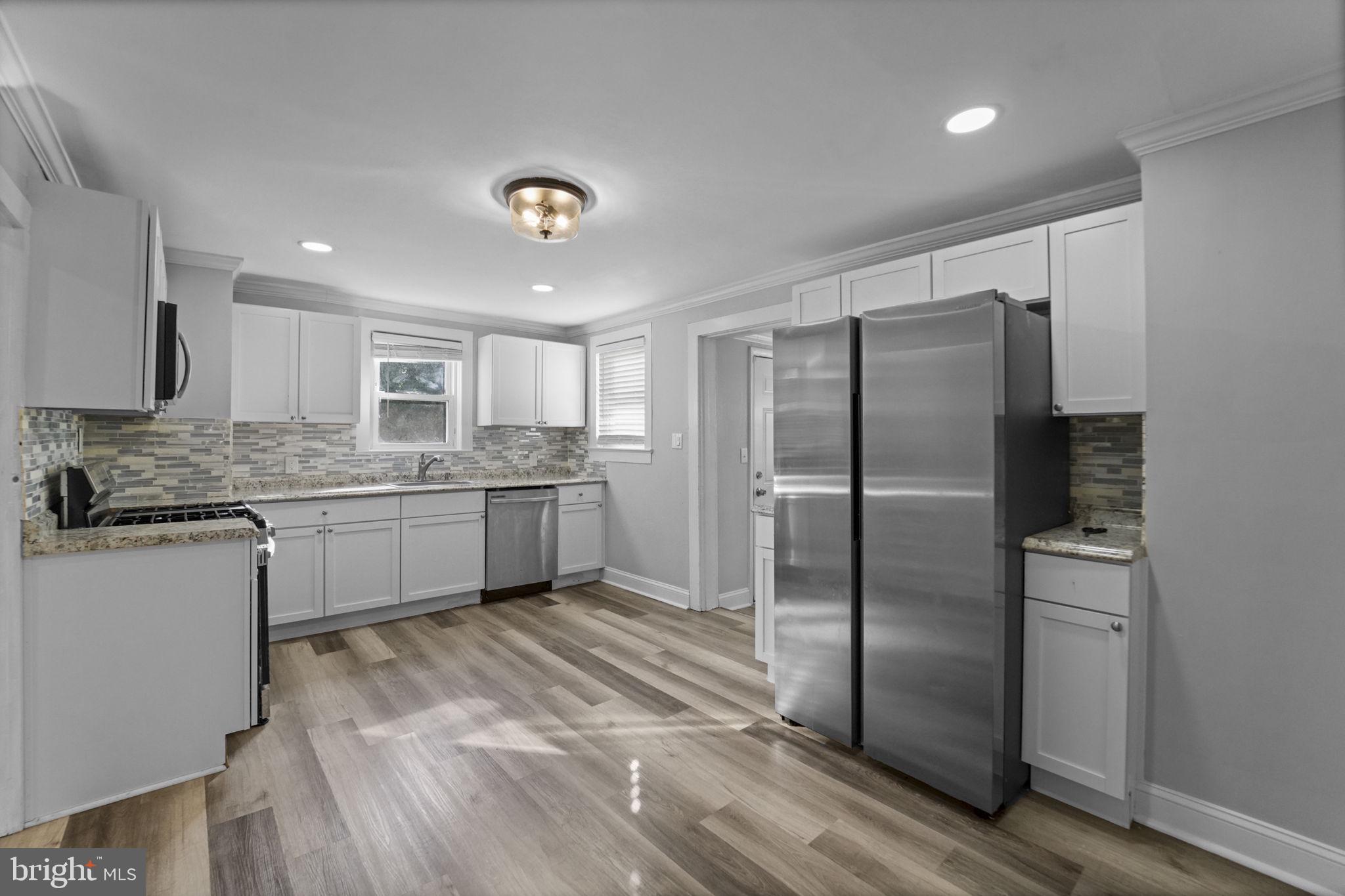 2652 South Main Road Vineland, NJ 08360 - Photo 23 of 44 a kitchen with a refrigerator sink and cabinets