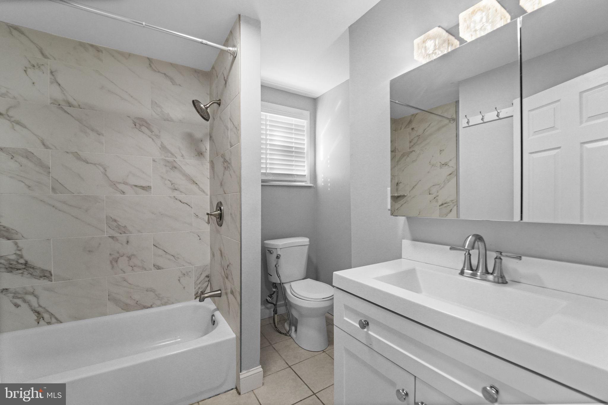 2652 South Main Road Vineland, NJ 08360 - Photo 25 of 44 a bathroom with a sink a toilet and a bathtub