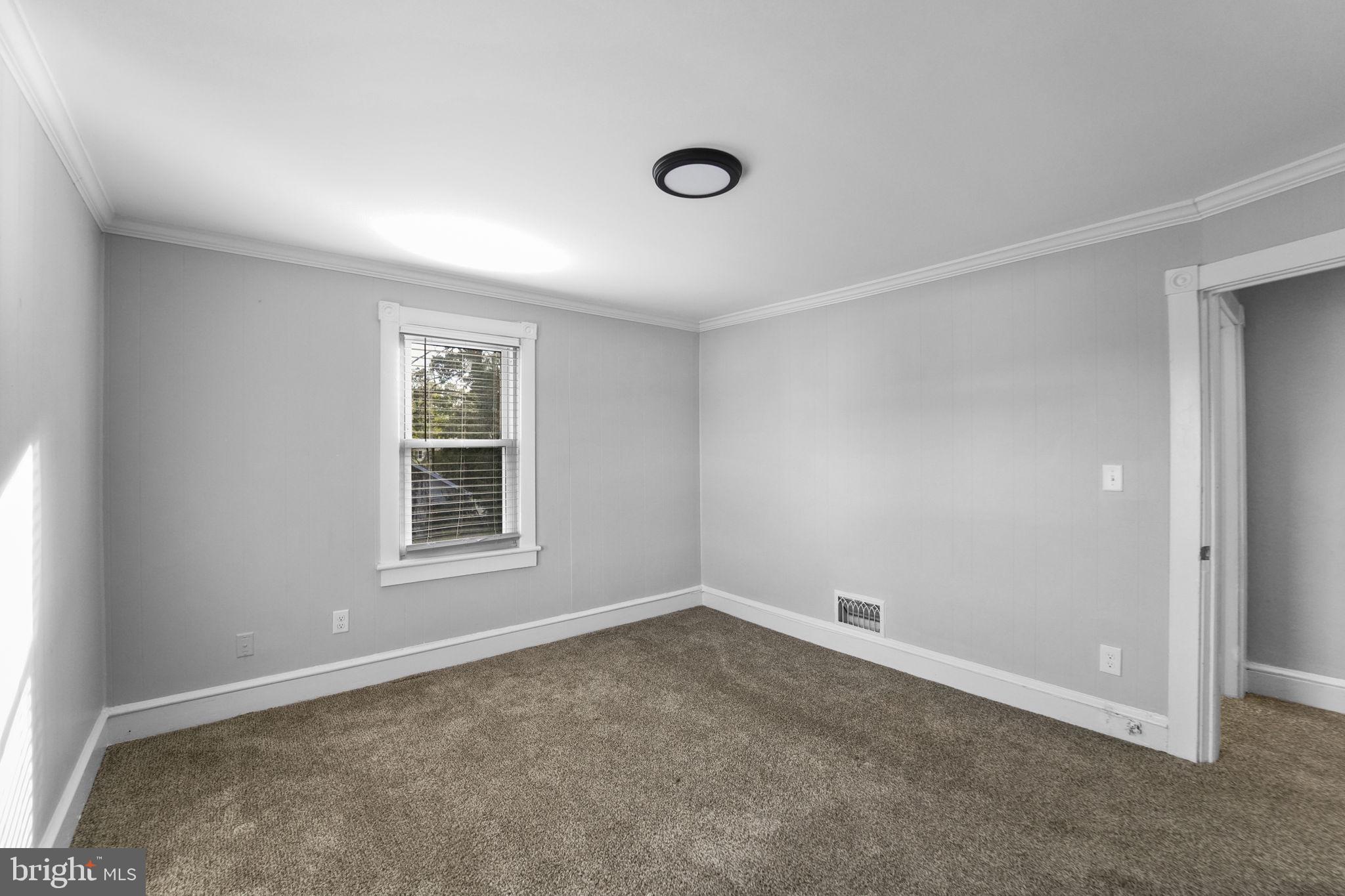 2652 South Main Road Vineland, NJ 08360 - Photo 34 of 44 an empty room with a window