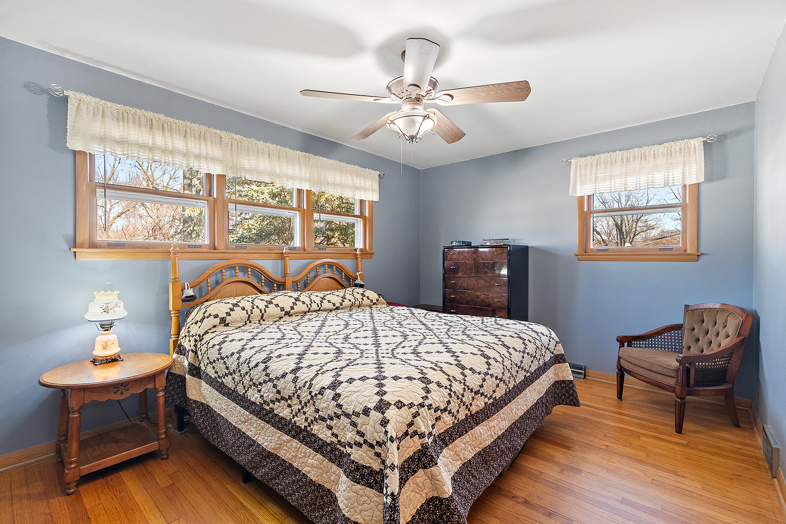 1423 Hillview Road Homewood, IL 60430 - Photo 12 of 23 a bedroom with a bed and a chandelier