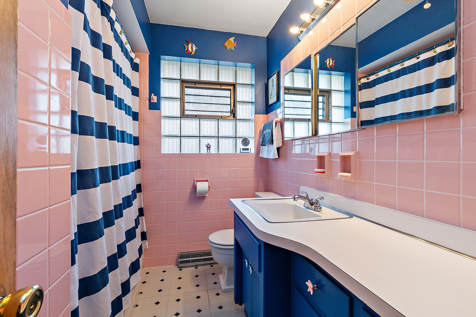 1423 Hillview Road Homewood, IL 60430 - Photo 15 of 23 a bathroom with a sink a toilet a shower curtain and a large mirror