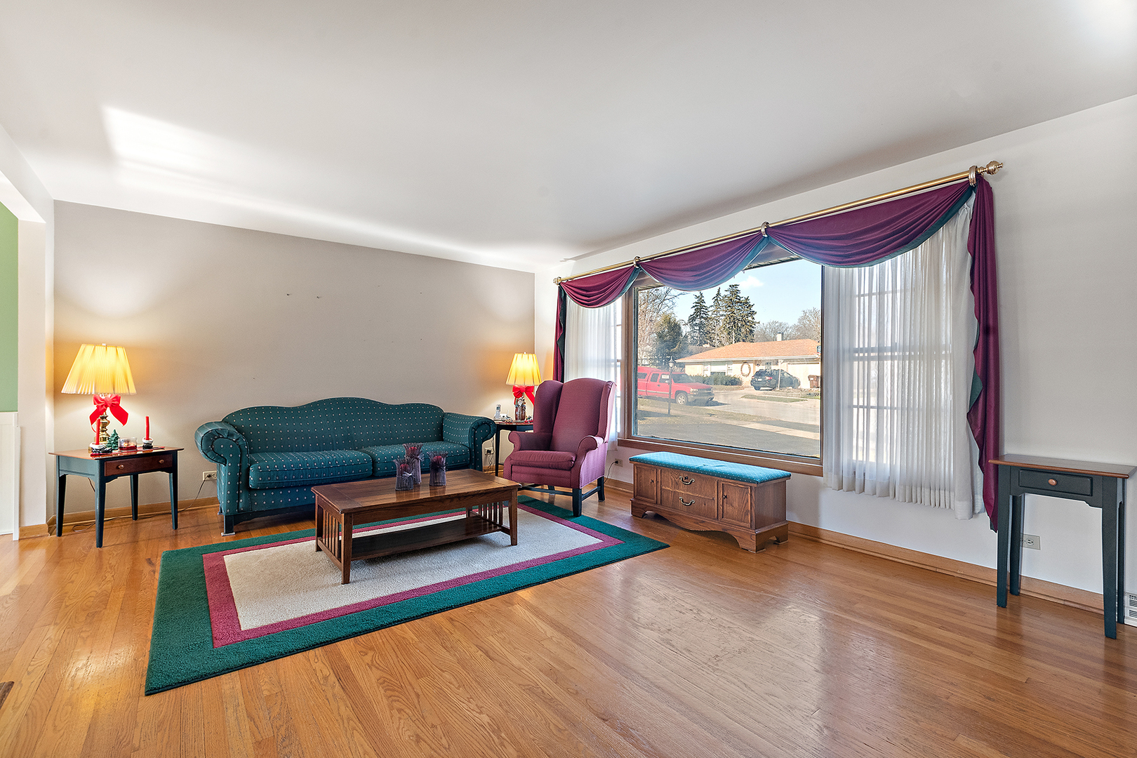 1423 Hillview Road Homewood, IL 60430 - Photo 6 of 23 a living room with furniture a wooden floor and a large window