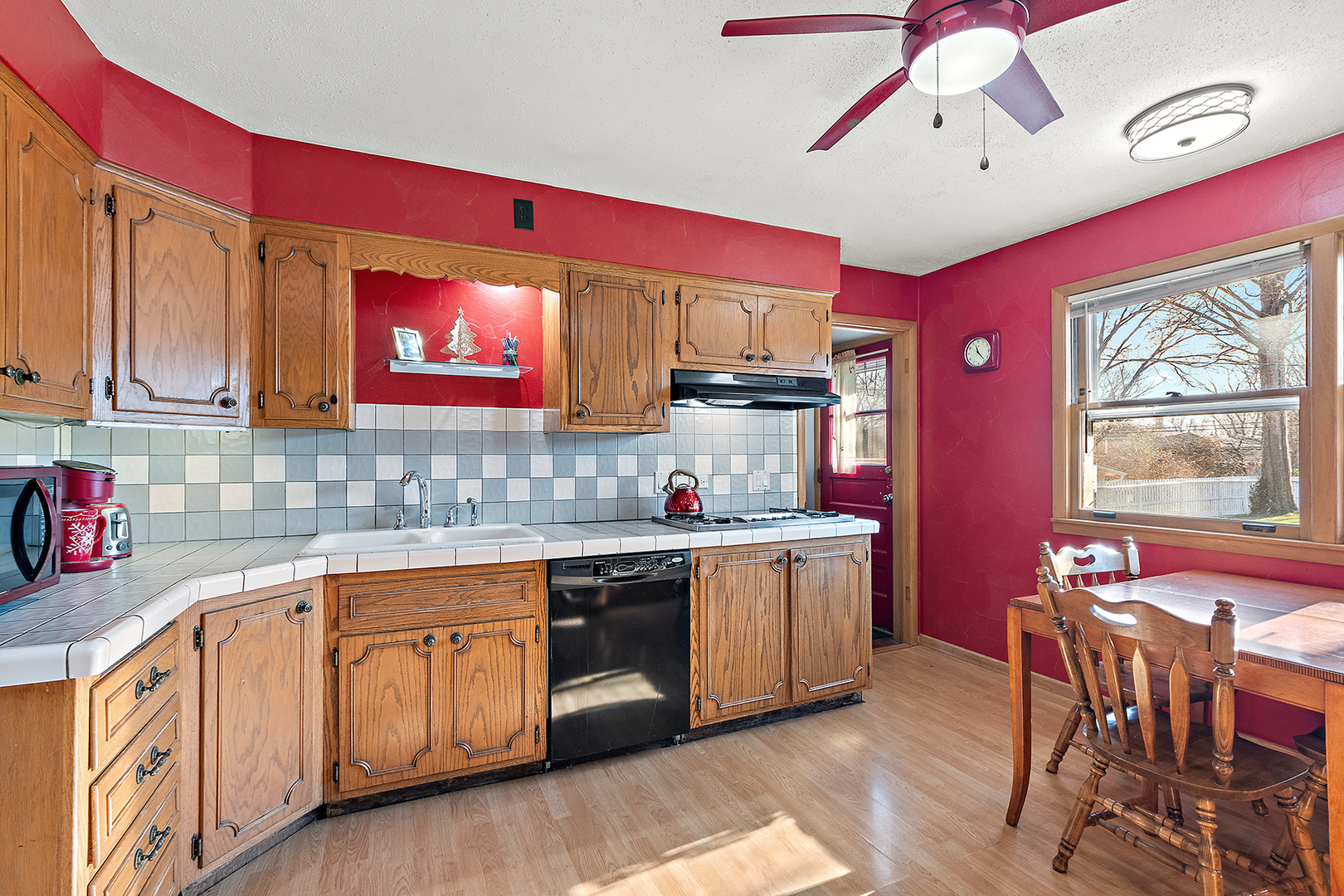 1423 Hillview Road Homewood, IL 60430 - Photo 9 of 23 a kitchen that has a lot of cabinets in it and wooden floors