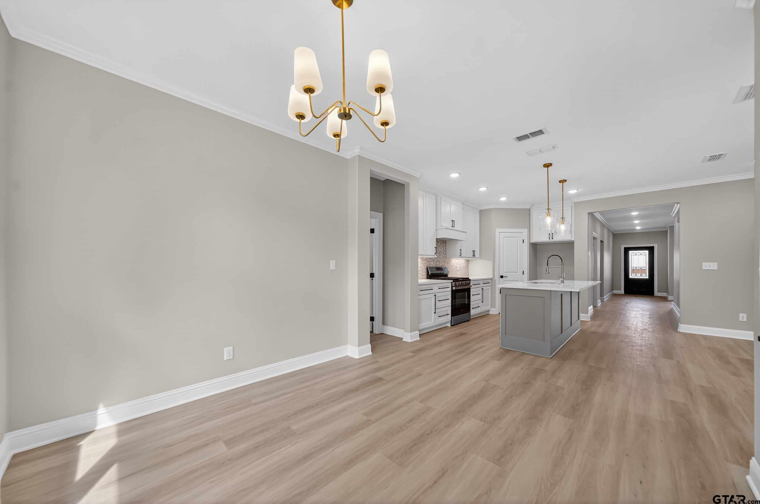 3049 Guinn Farms Road Tyler, TX 75707 - Photo 15 of 43 a view of a kitchen and a chandelier