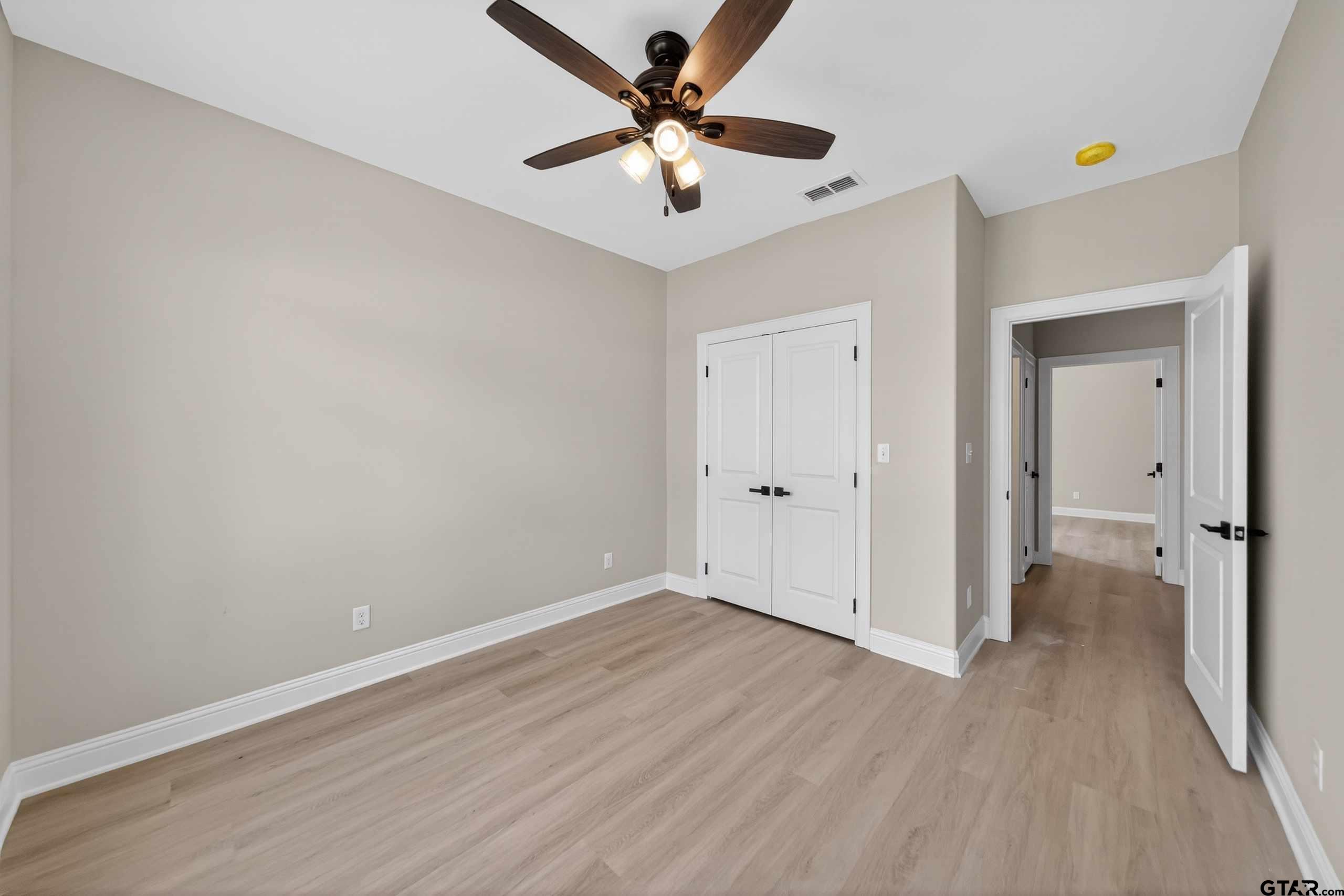 3049 Guinn Farms Road Tyler, TX 75707 - Photo 35 of 43 wooden floor in an empty room