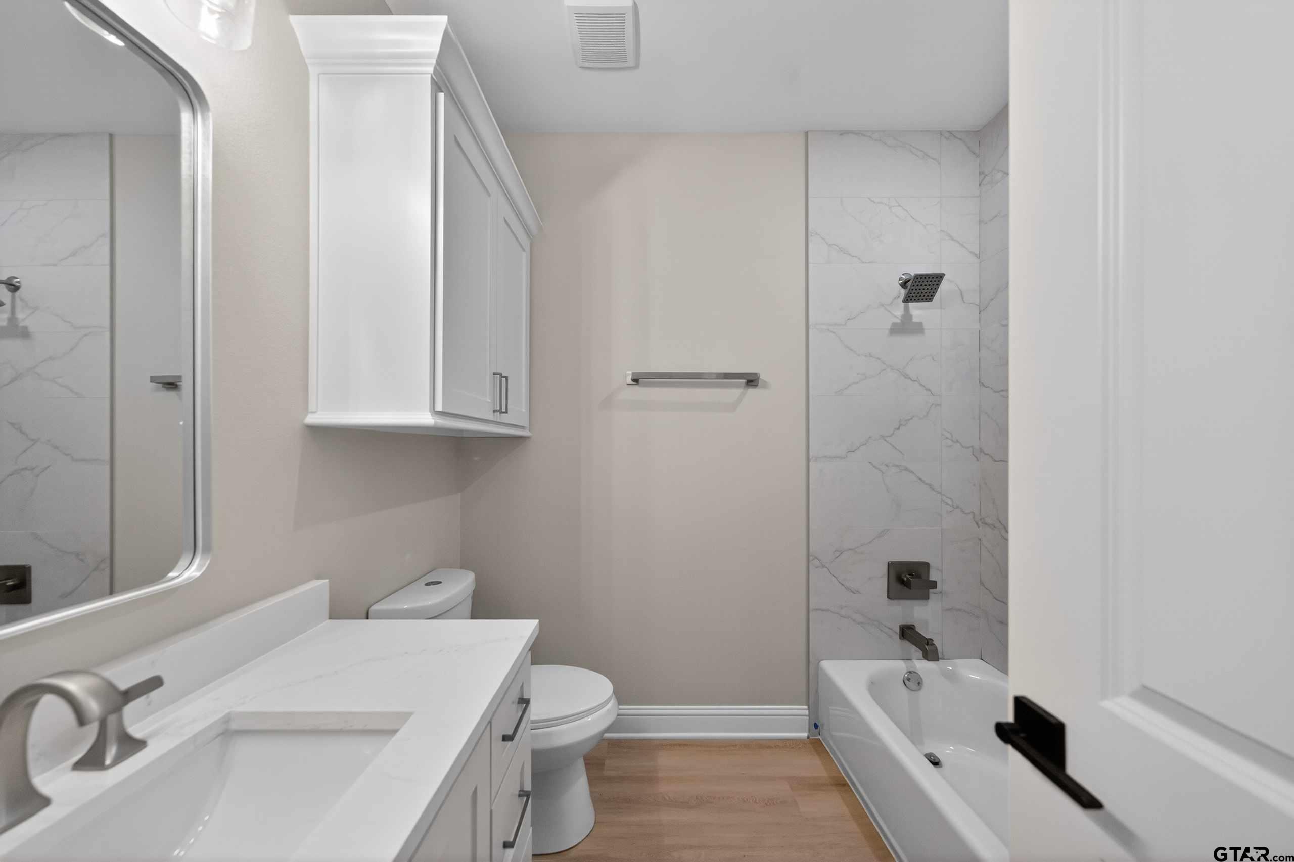 3049 Guinn Farms Road Tyler, TX 75707 - Photo 36 of 43 a bathroom with a sink a toilet and shower