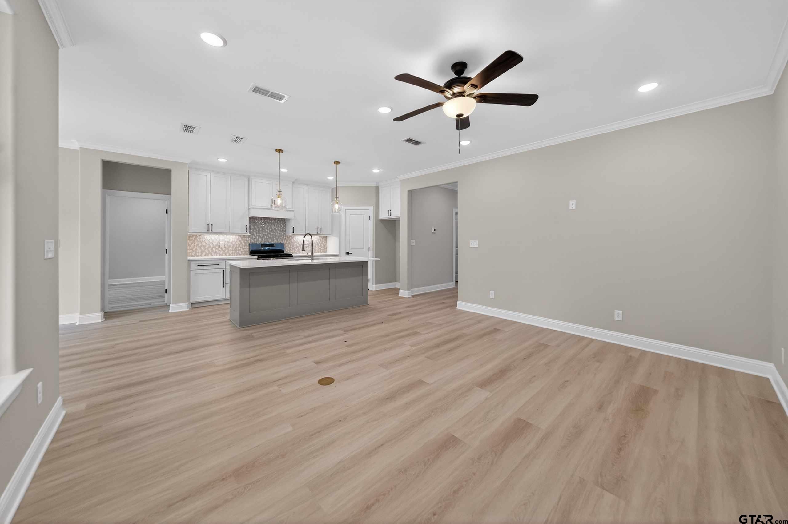 3049 Guinn Farms Road Tyler, TX 75707 - Photo 6 of 43 a view of kitchen with wooden floor and window