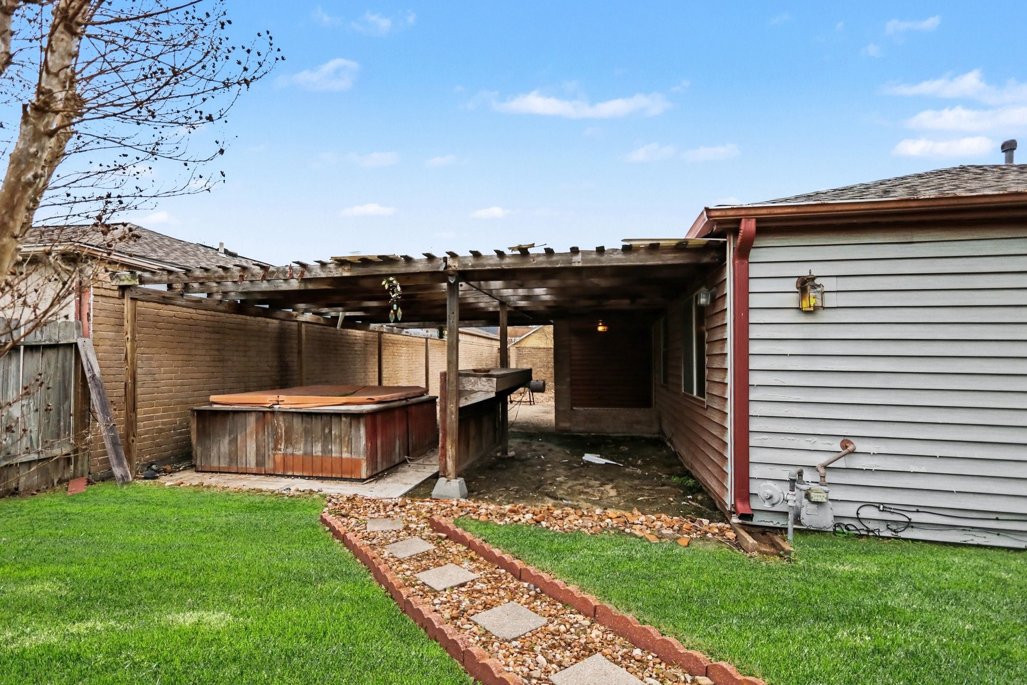 12151 Swords Creek Road Houston, TX 77067 - Photo 19 of 20 a view of a house with a backyard and a patio