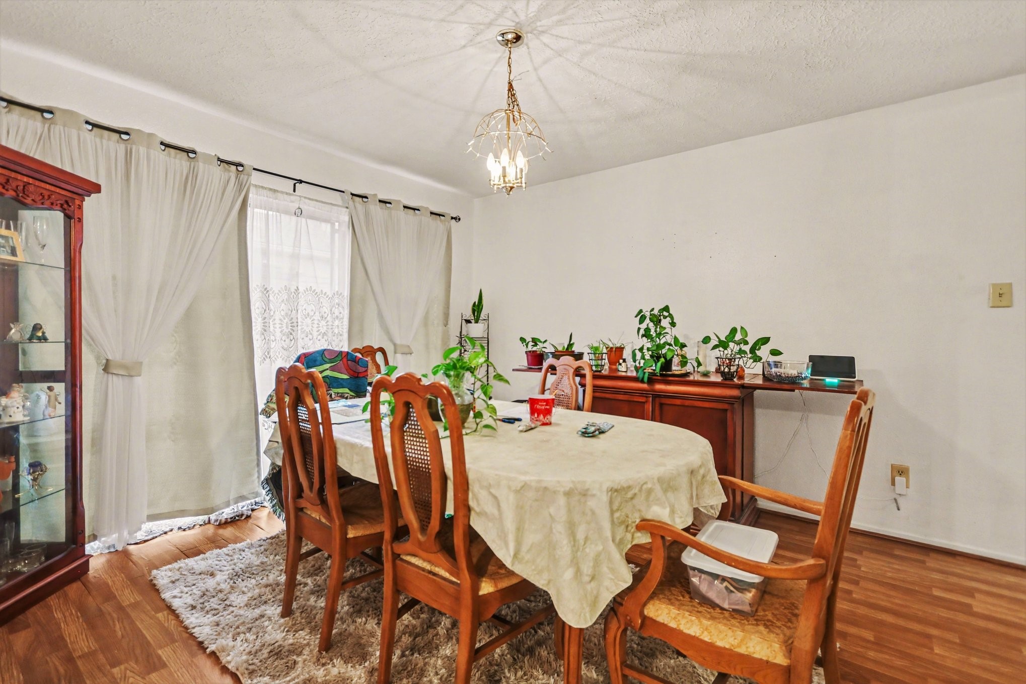 12151 Swords Creek Road Houston, TX 77067 - Photo 7 of 20 a view of a dining room with furniture and wooden floor