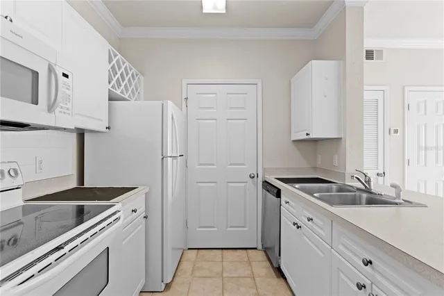 a kitchen with a sink stove and refrigerator