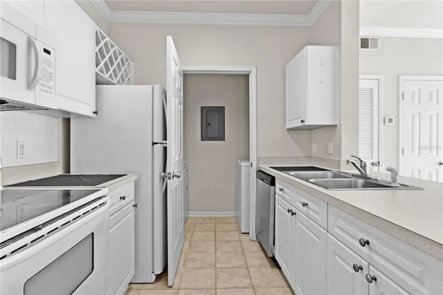 a kitchen with granite countertop a sink and a stove
