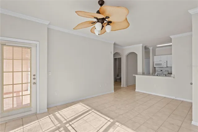 a view of livingroom with hardwood floor and a ceiling fan