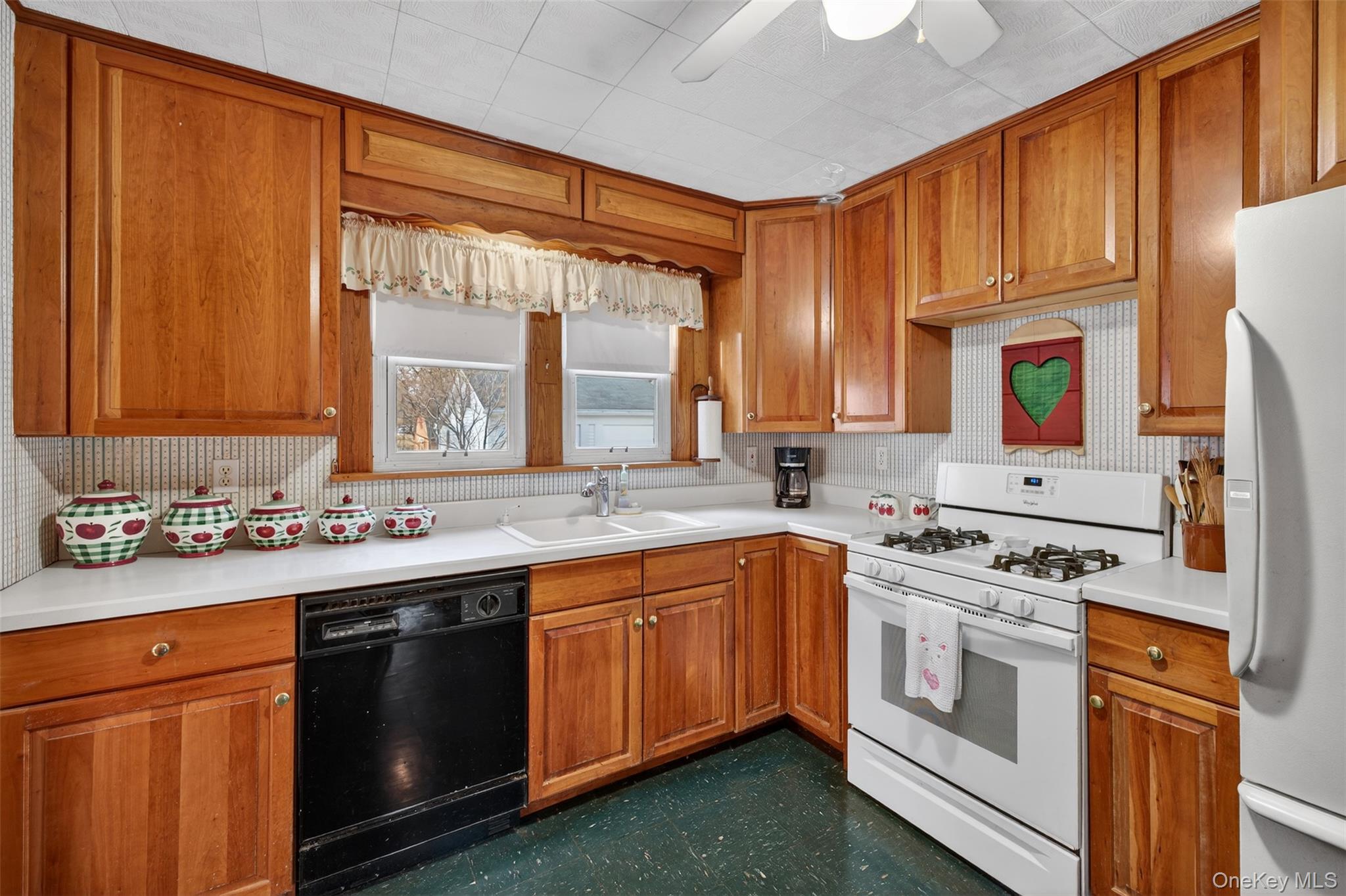 21 Innis Avenue Newburgh, NY 12550 - Photo 7 of 22 a kitchen with a sink stove and cabinets