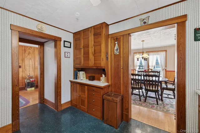 a view of kitchen with furniture and wooden floor