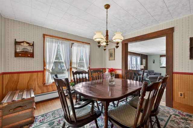a view of a dining room with furniture window and outside view