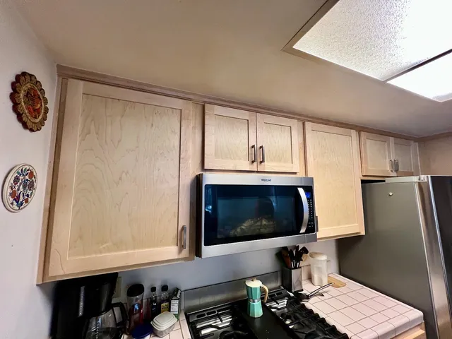 a room with a wooden floor and a sink