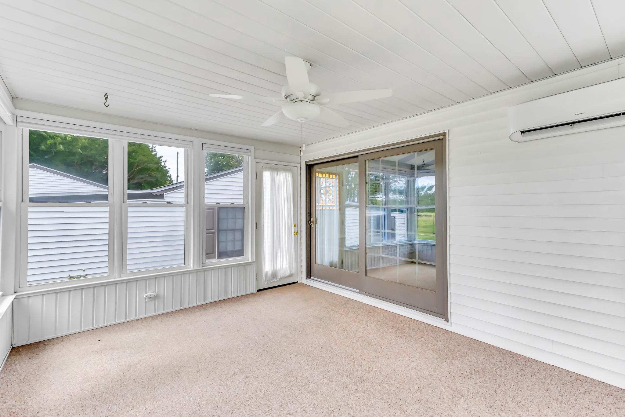 11163 Stewart Neck Road Princess Anne, MD 21853 - Photo 22 of 80 Bright and airy four seasons room off of den.