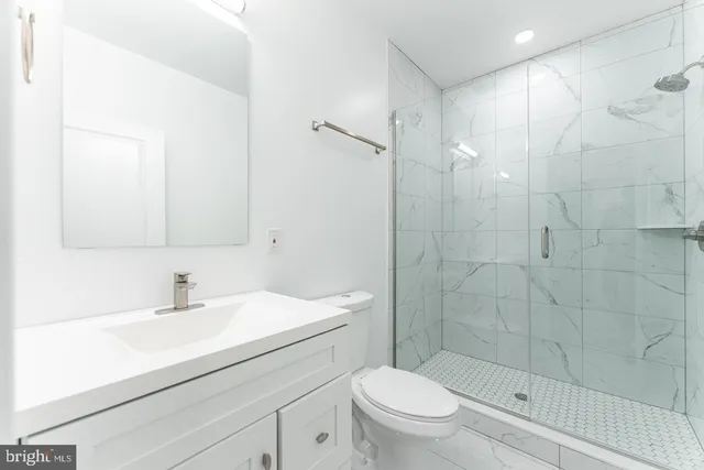 a bathroom with a toilet a sink and bathtub