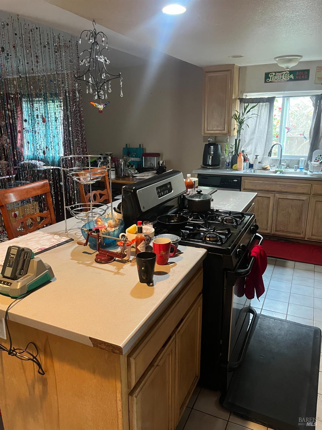 1889 Jennings Avenue Santa Rosa, CA 95401 - Photo 3 of 10 a kitchen with a sink a stove and a refrigerator