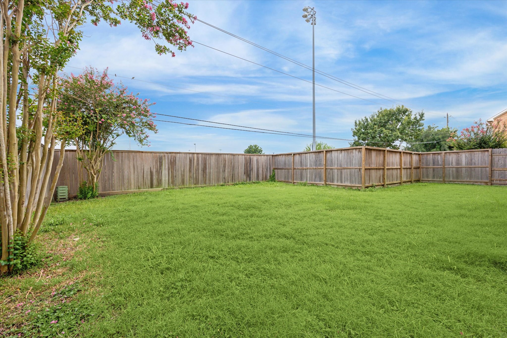 9829 Riddlelink Lane Houston, TX 77025 - Photo 19 of 22 Expansive fenced backyard with plenty of room for pets, play, or entertaining - a rare find for city living.