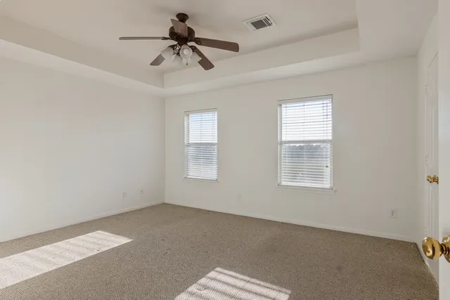 a bathroom with a sink vanity granite shower and a mirror