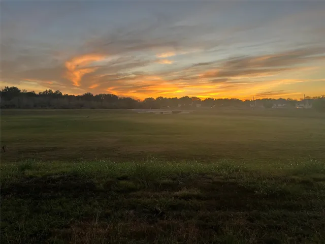 a view of a lake with houses in the back