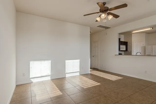 a kitchen with a stove a refrigerator and a sink