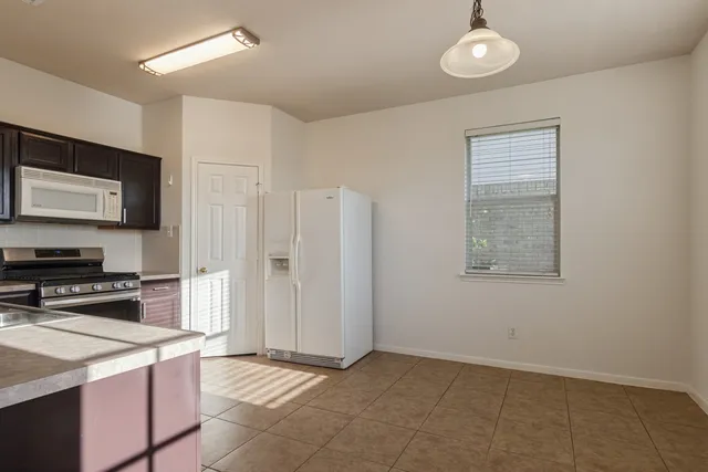 a kitchen with stainless steel appliances granite countertop a stove and a sink