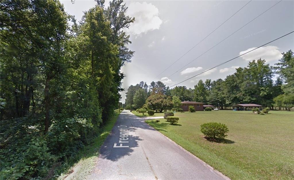 0 Freeman Drive, Unit 128 Stockbridge, GA 30281 - Photo 4 of 5 a view of a park with large trees