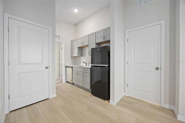 a kitchen with a refrigerator freezer and a dishwasher