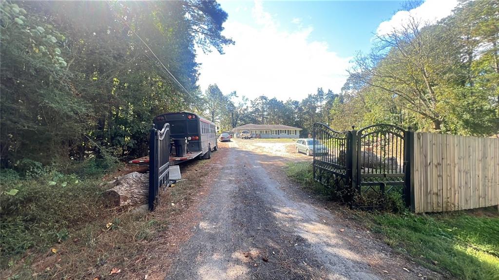 a view of a yard with large trees